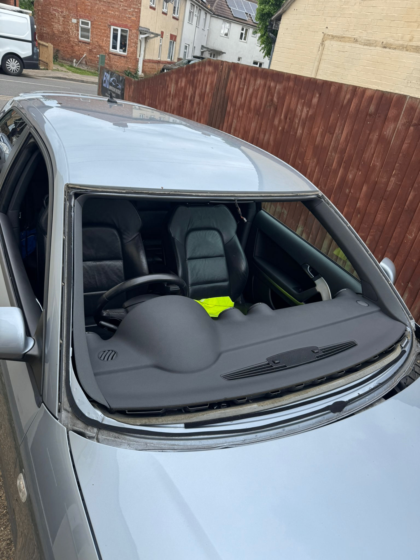 Audi A4 windscreen bonded, taped for cure, Peterborough workshop